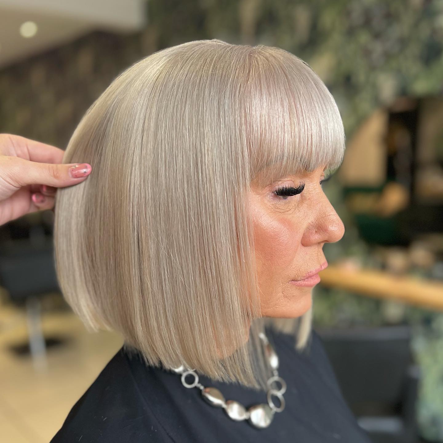 Over 50 Polished Blonde Bob with Bangs